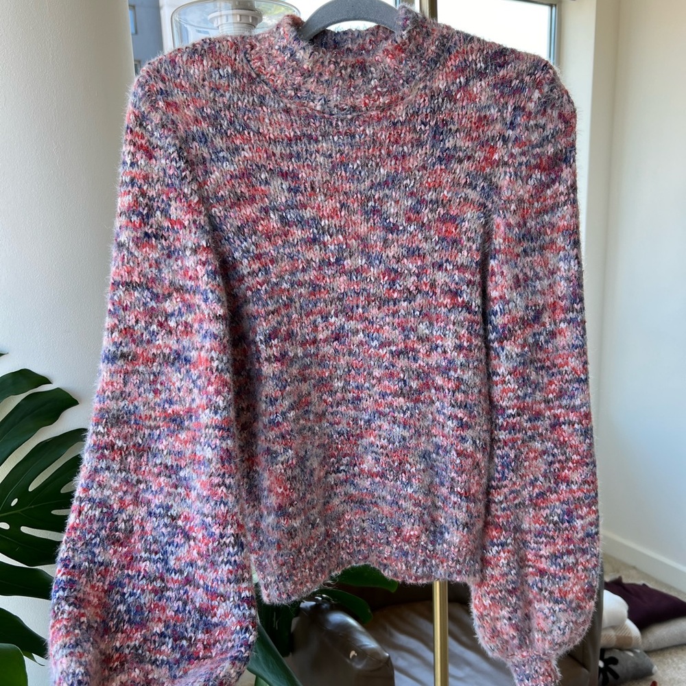Multi-colored knitted sweater with mock neck and long sleeves